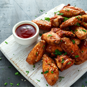 Chicken wings on cutting board